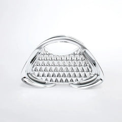 Triangular metallic object with pyramid pattern on a white background