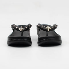 Front view of black platform thong sandals with silver metal stud details.