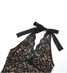 Black lace bralette with bow on a white background