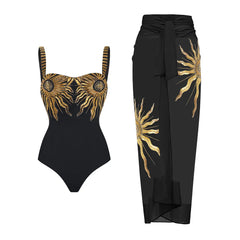 Black one-piece swimsuit and matching beach cover-up with golden sunburst embellishments.