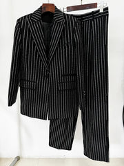 Black and white pinstripe suit on a hanger against a white background