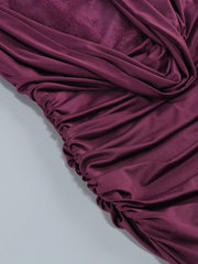 Close-up of burgundy fabric on a light gray background