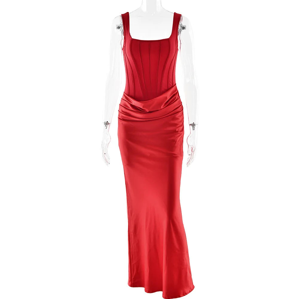 Red evening gown on a mannequin against a white background