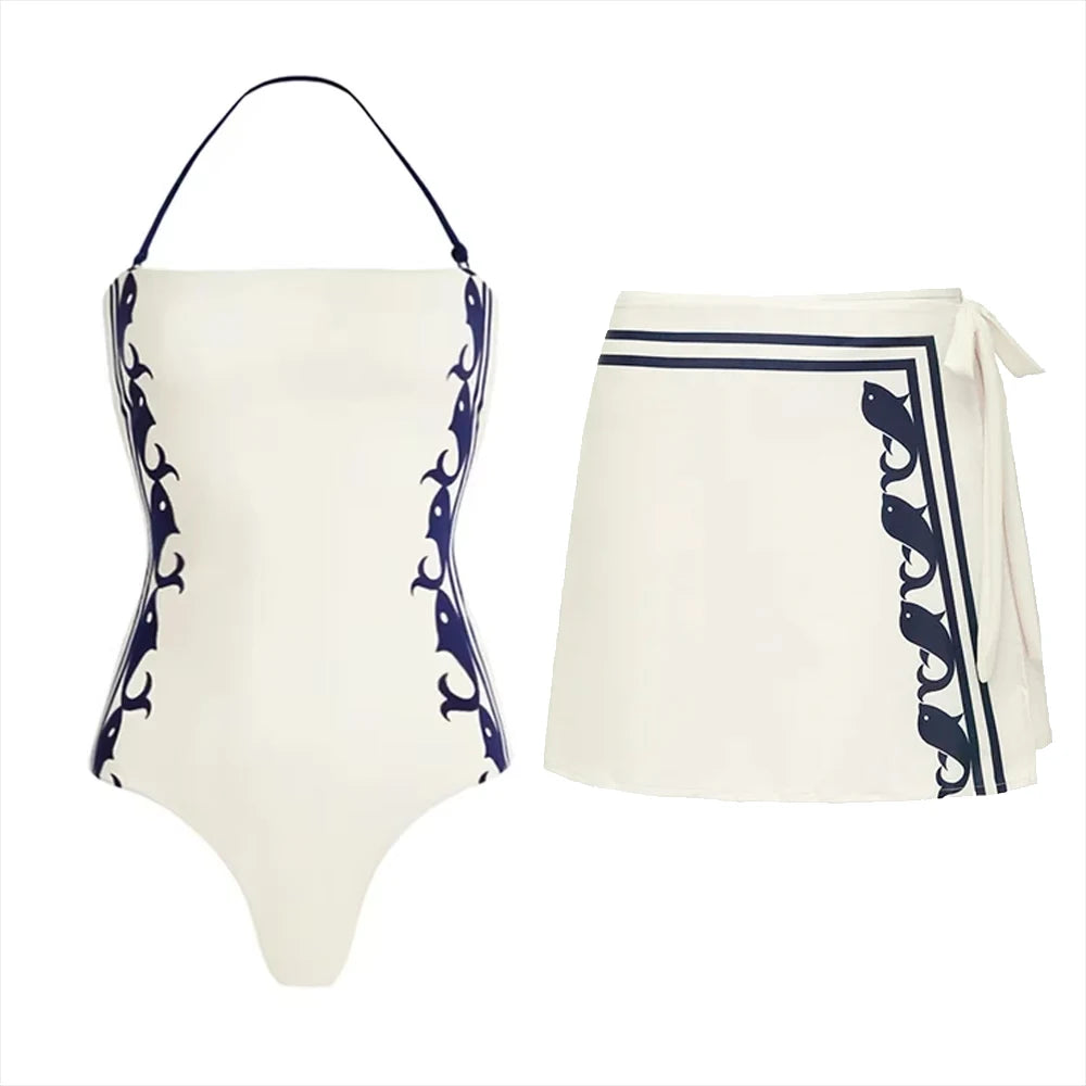 White halter swimsuit with side whale print and white wrap skirt