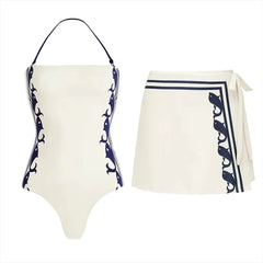 White halter swimsuit with side whale print and white wrap skirt