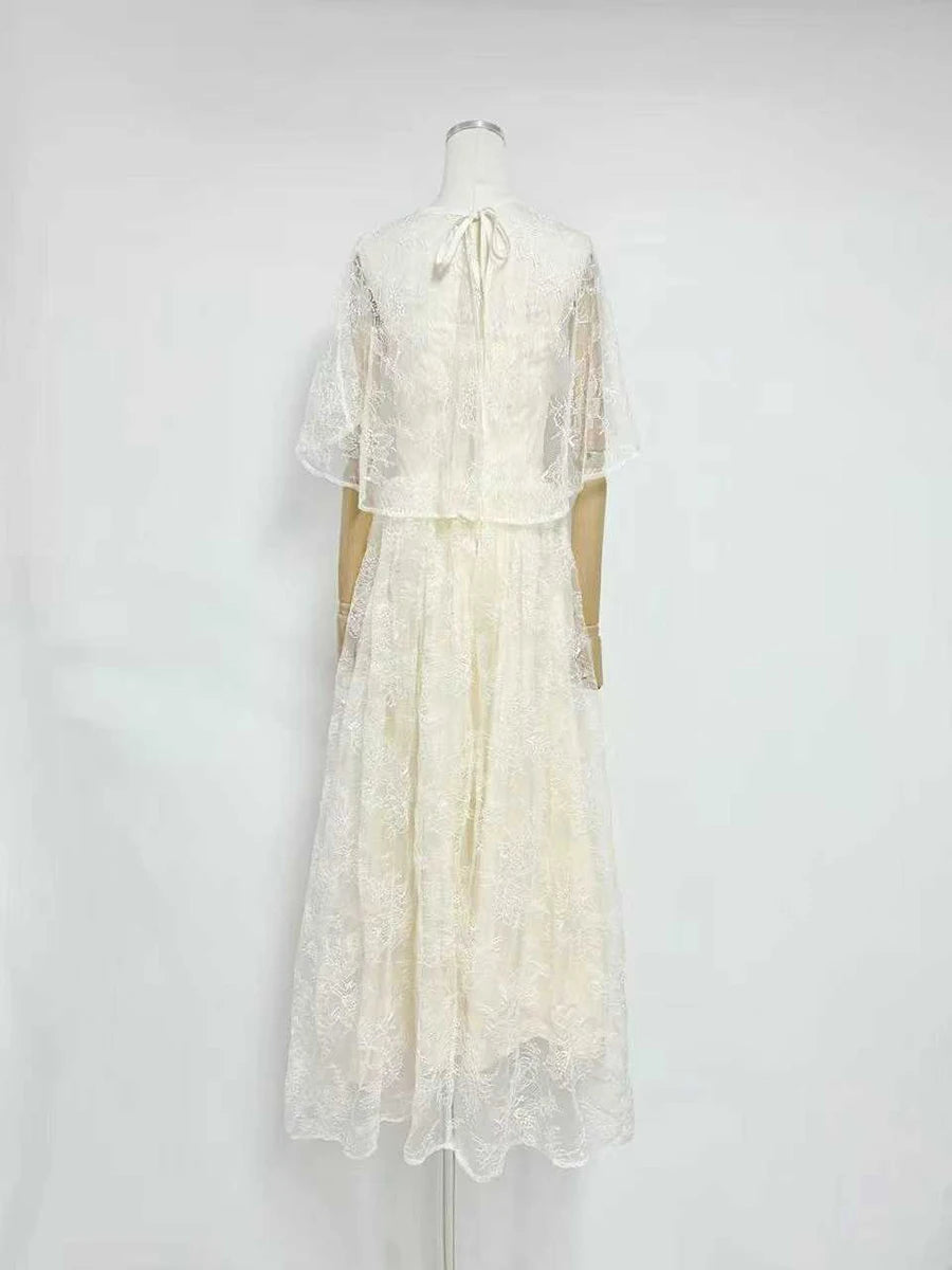 Back view of white lace cape sleeve maxi dress