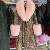 Leopard print coat with pink fur trim hanging in a store.
