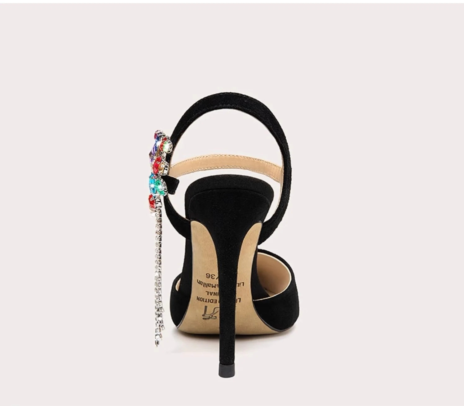 Black high-heeled shoe with colorful embellishments on a white background