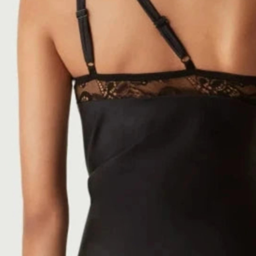 Black lace-trimmed nightgown on a plain background
