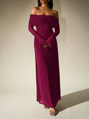 Magenta off-shoulder gown with long sleeves on a plain background