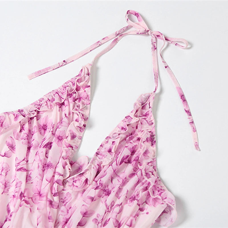 Pink floral bikini top with tie straps on a white background