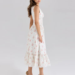 White floral dress on a model against a plain background