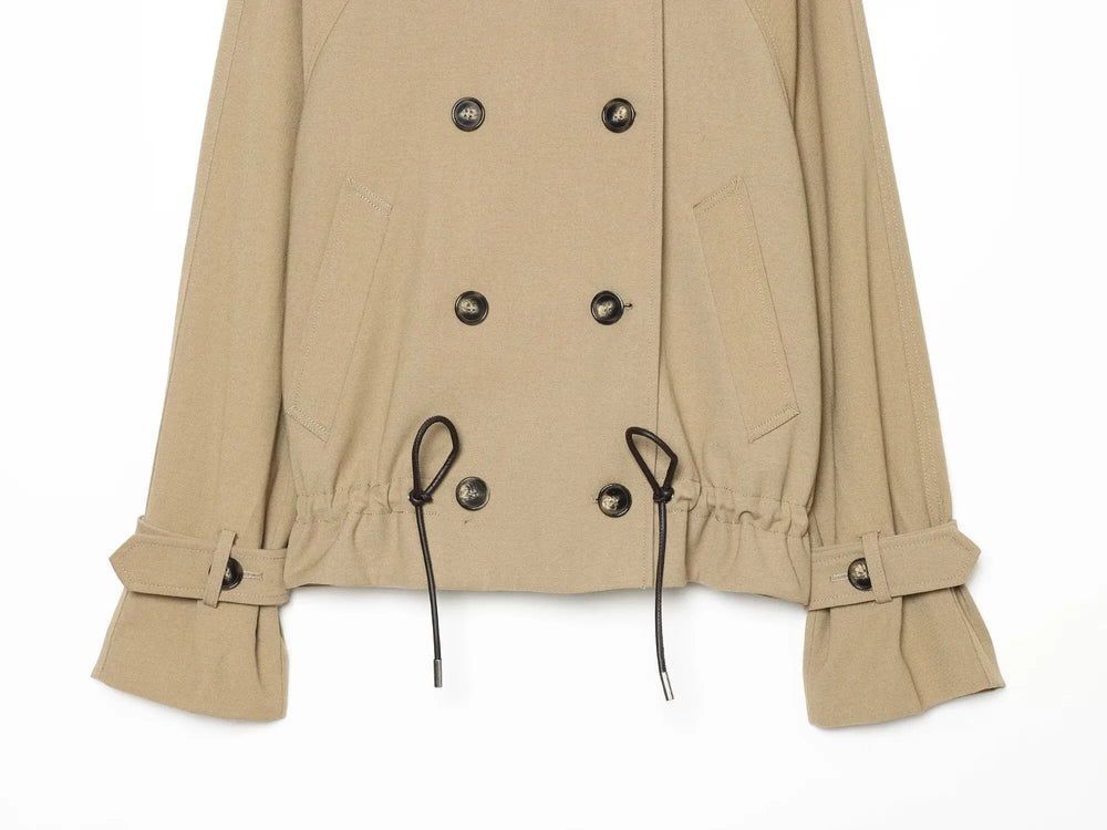 Drawstring waist detail on double breasted coat