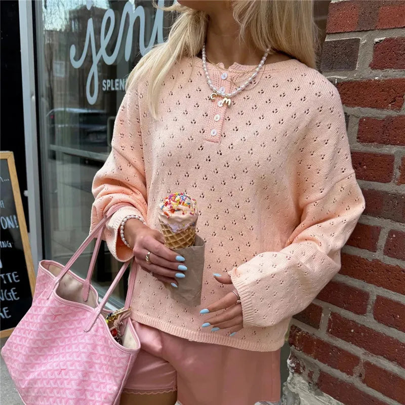 Peach eyelet knit button placket top