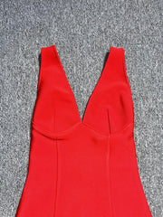 Red dress with a V-neck on a gray textured background