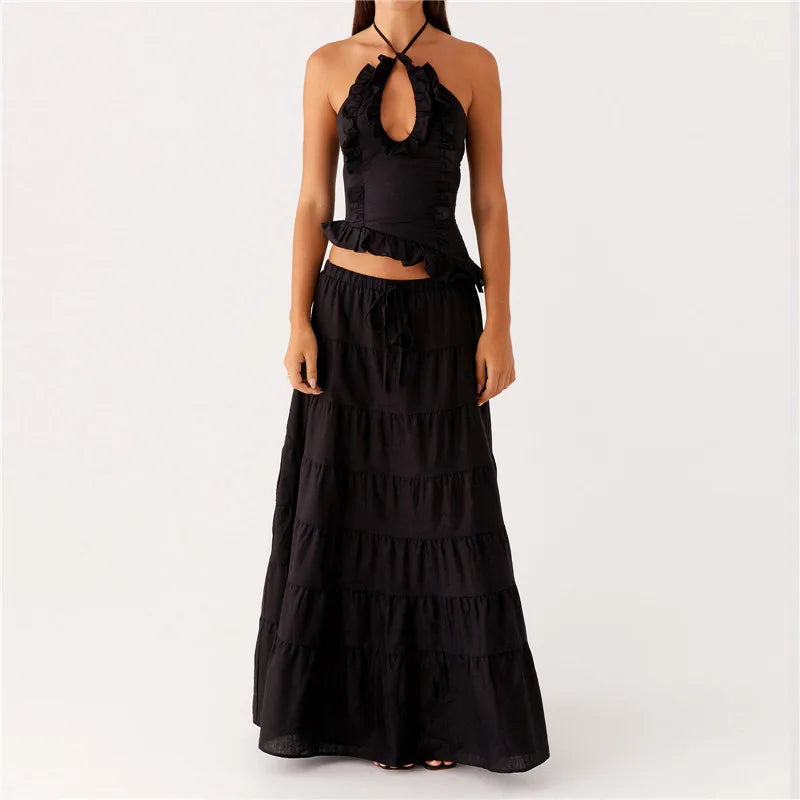 Black tiered dress on a white background