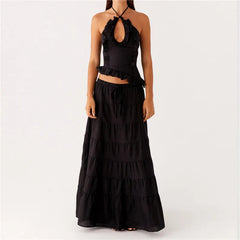 Black tiered dress on a white background