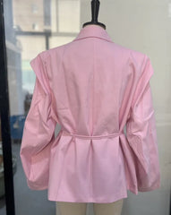 Pink jacket on a mannequin against a neutral background