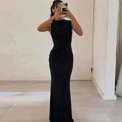 Black draped ruched maxi dress with high neck held by model
