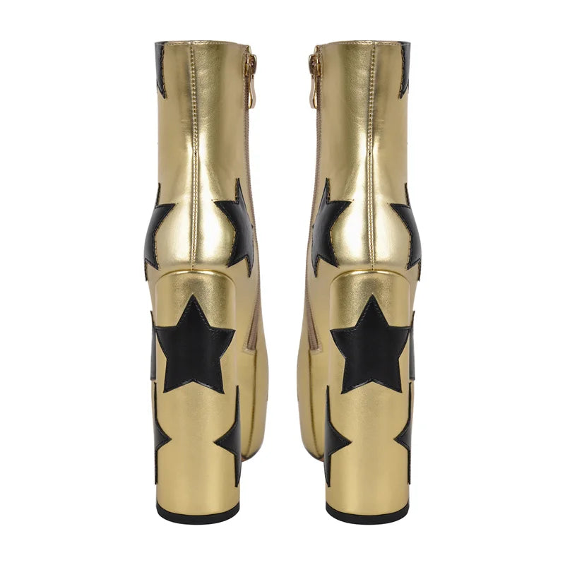 Rear view of metallic gold platform ankle boots featuring black star appliques.