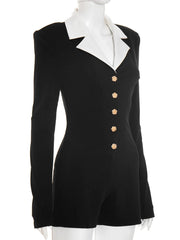 Black dress with white collar and gold buttons on a mannequin against a white background