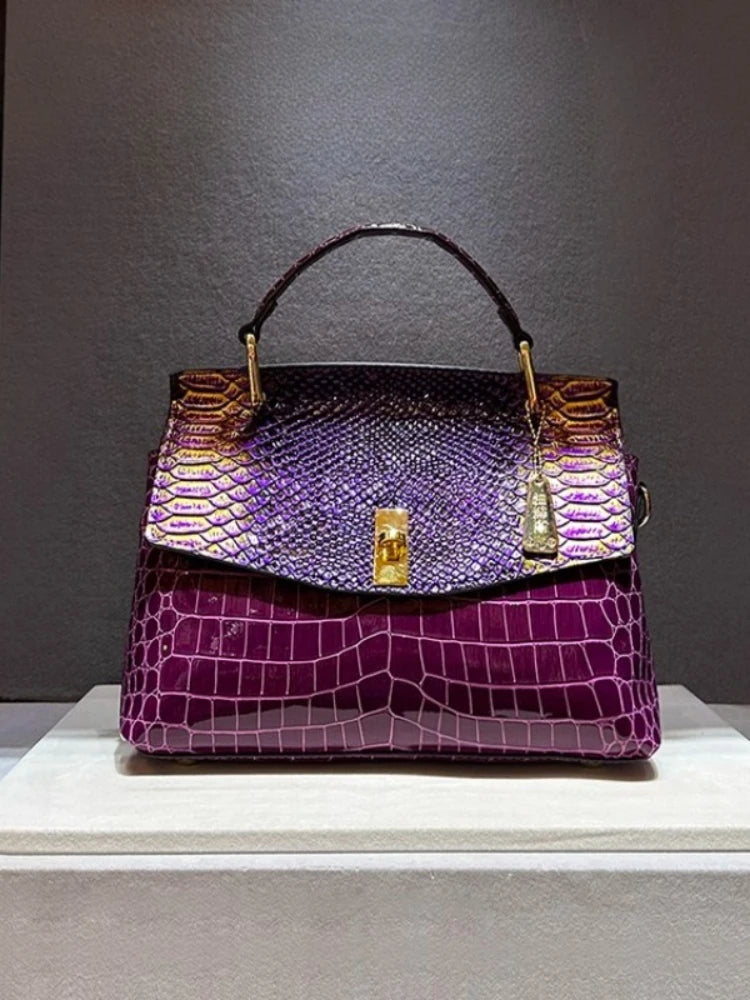 Purple embossed leather satchel bag with snake print flap