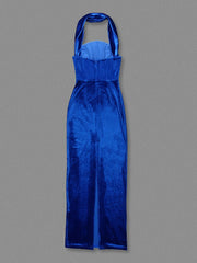 Blue satin halter neck gown on a gray background