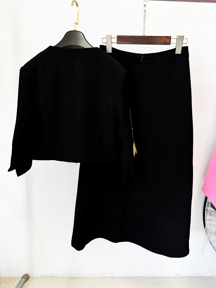Back view of beaded cropped jacket and midi skirt suit