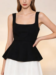 Close-up of a black square neck peplum tank top