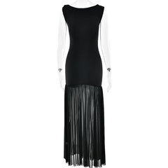 Black dress with sheer pleated skirt on a white background