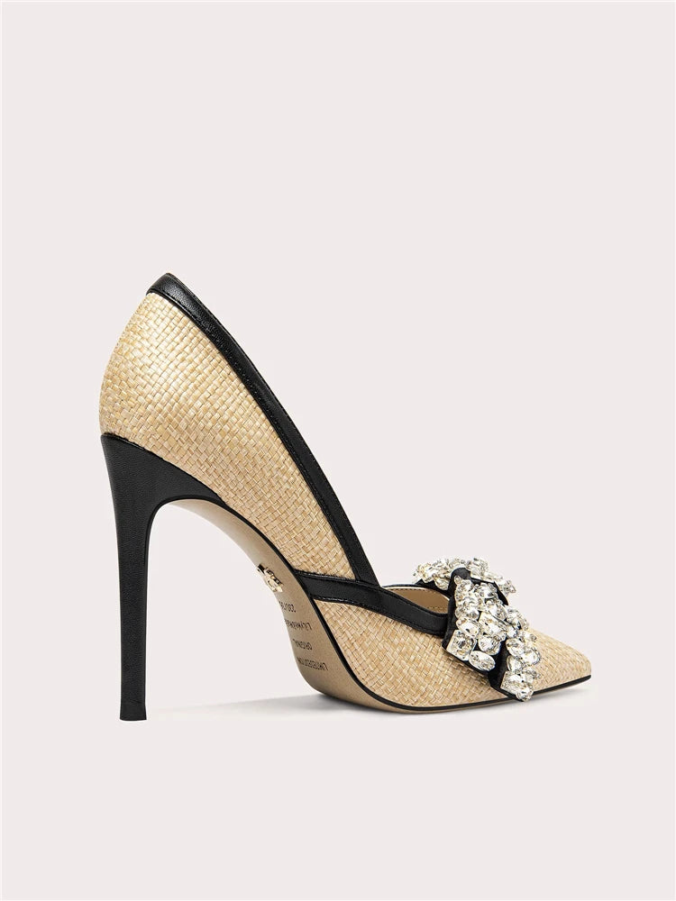 High-heeled shoe with straw-like texture and black trim on a light gray background