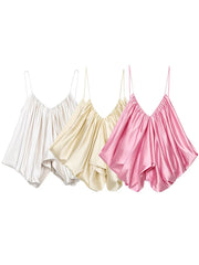 Three satin camisoles in white, beige, and pink