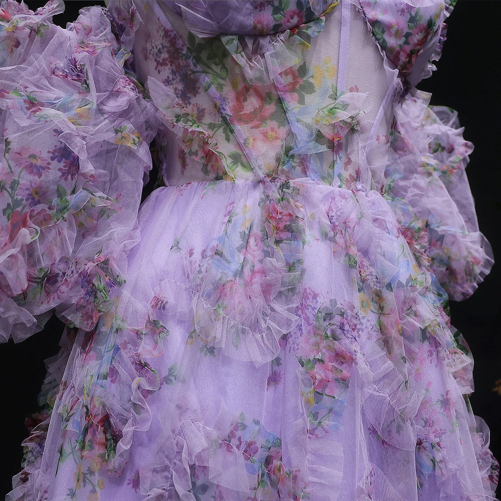 Floral dress with ruffled layers on a black background