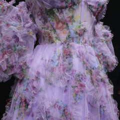 Floral dress with ruffled layers on a black background