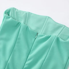 Close-up of a light green garment on a white background