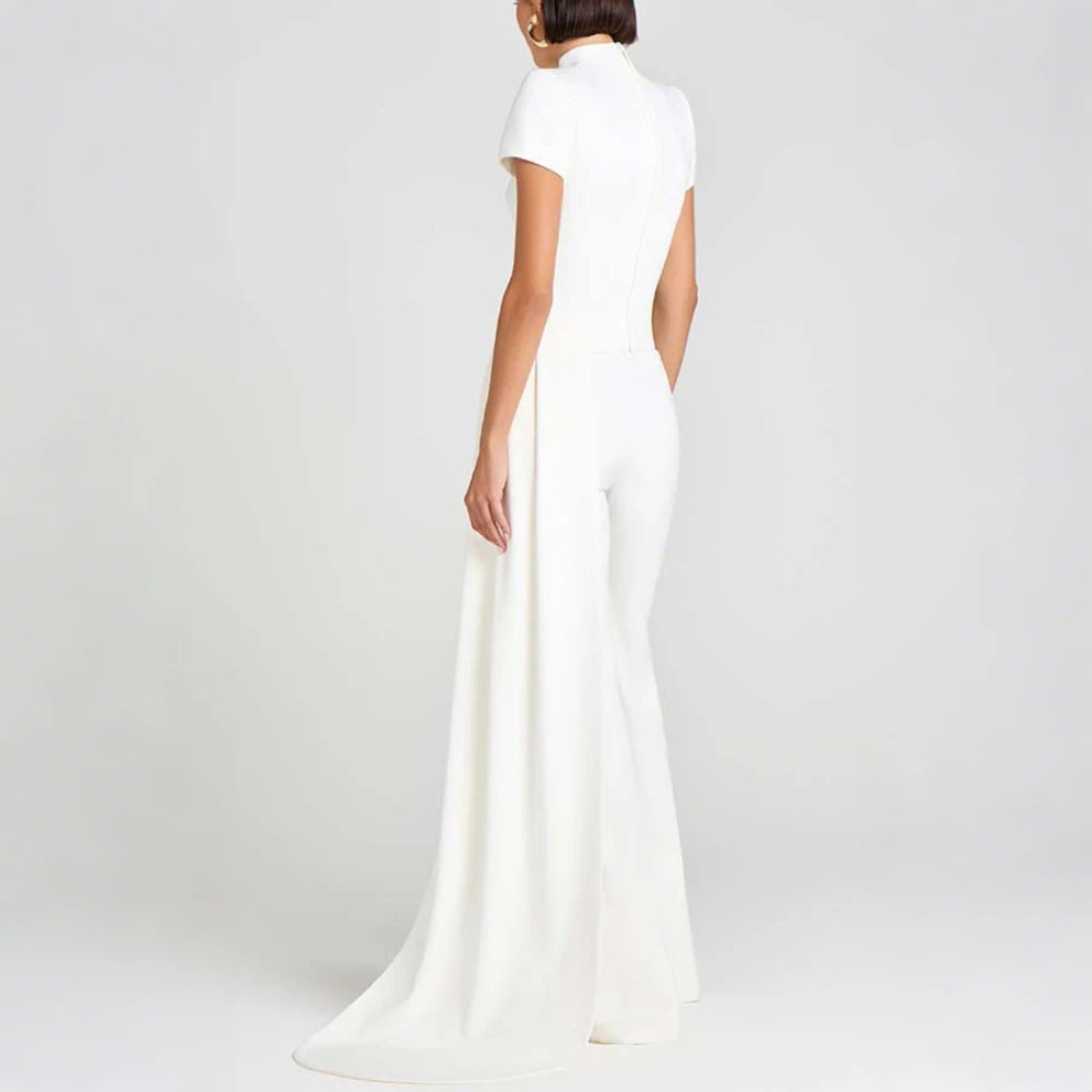 White evening jumpsuit on a plain background