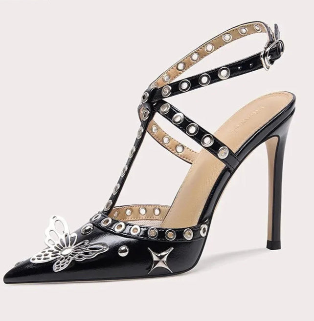 Black high-heeled sandal with decorative straps and embellishments on a white background