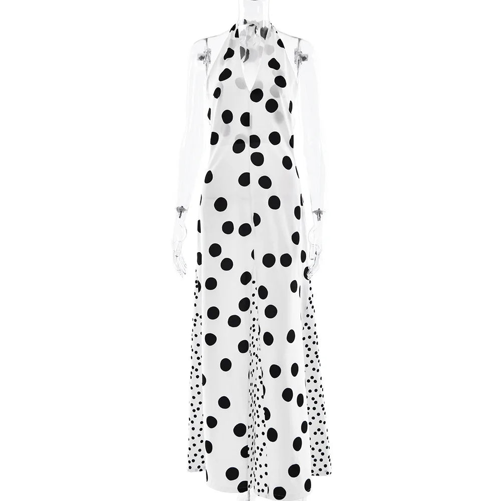 White dress with black polka dot pattern on a white background