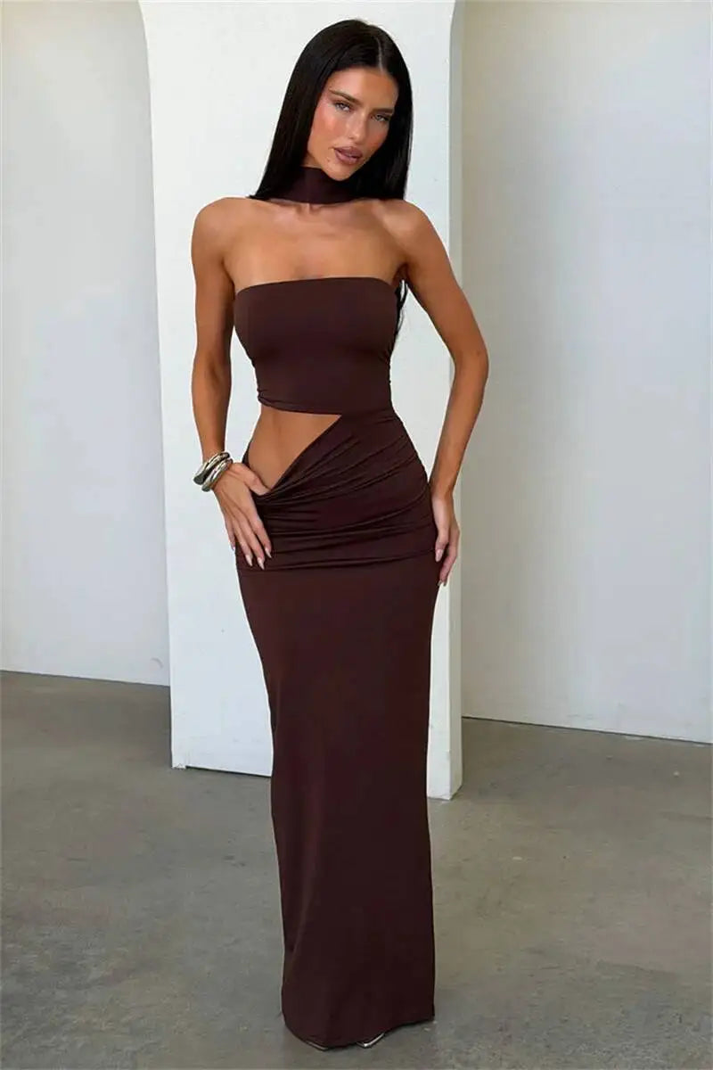 Close-up of the draped skirt detail on a strapless maxi dress