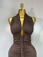Close-up of halter neck ruched knit ankle-length dress neckline