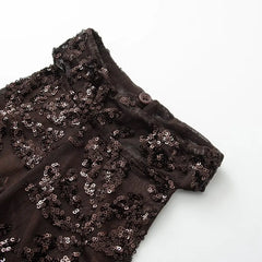 Black sequin fabric on a white background