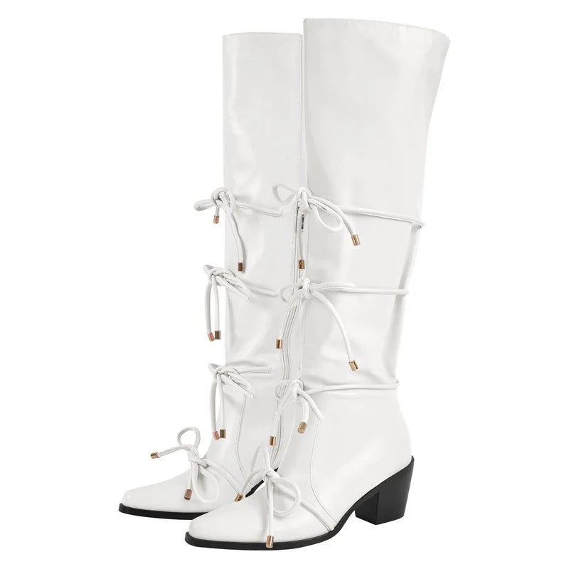 White pointed toe knee high boots with bow detail and block heel