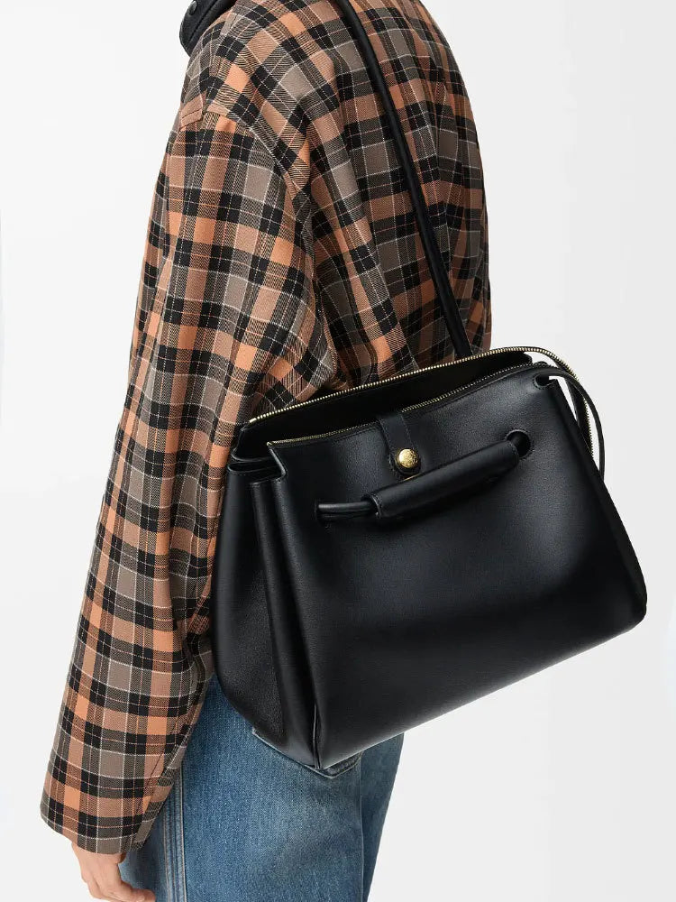 quiet luxury shoulder bag in bordeaux and black variants