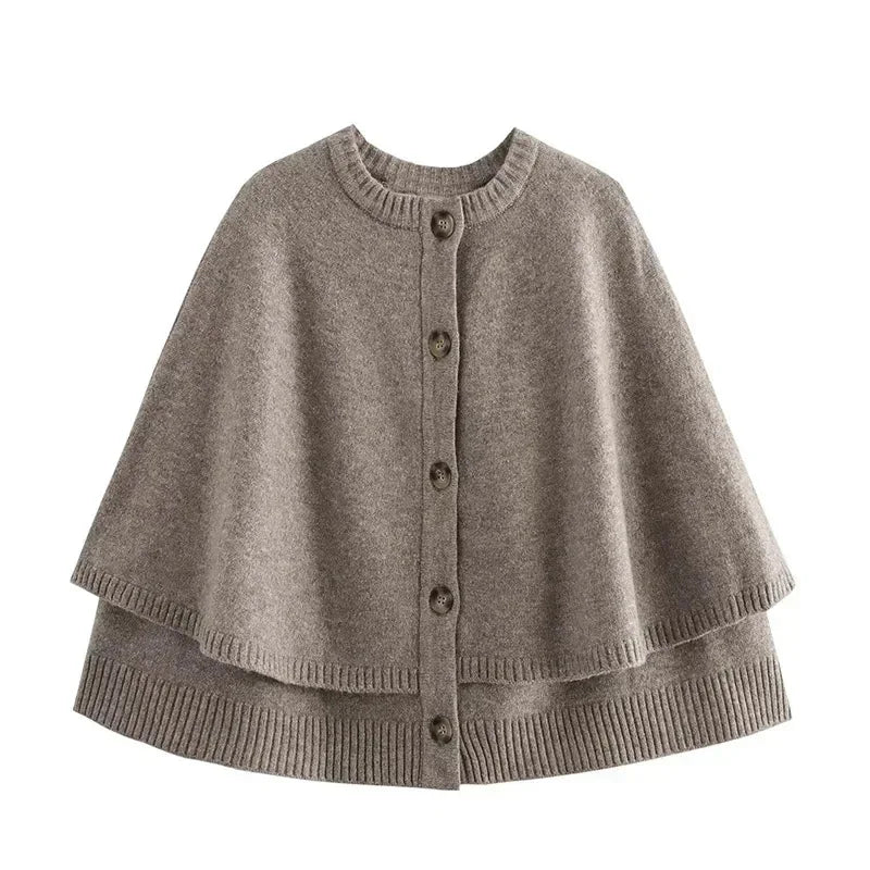 Gray knitted cape with buttons on a white background