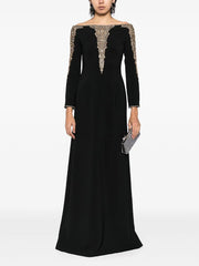 Black long sleeve maxi dress with beaded neckline and cuffs worn by a model.