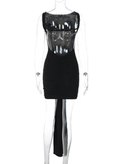 Black dress with sheer panels on a mannequin against a white background