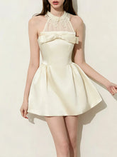 Halter neck dress with a bow accent and mesh collar