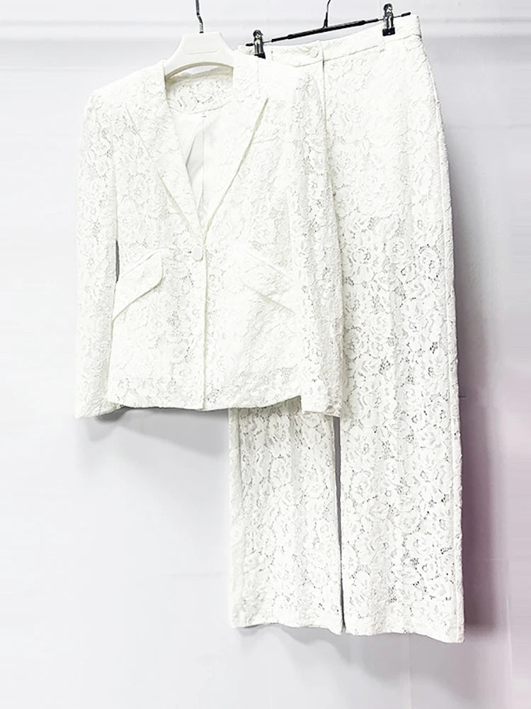 White lace outfit on a hanger against a white background