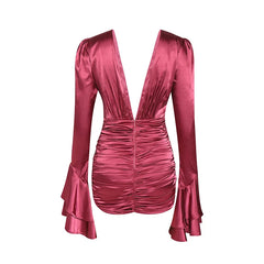 Pink satin dress with ruched details on a white background