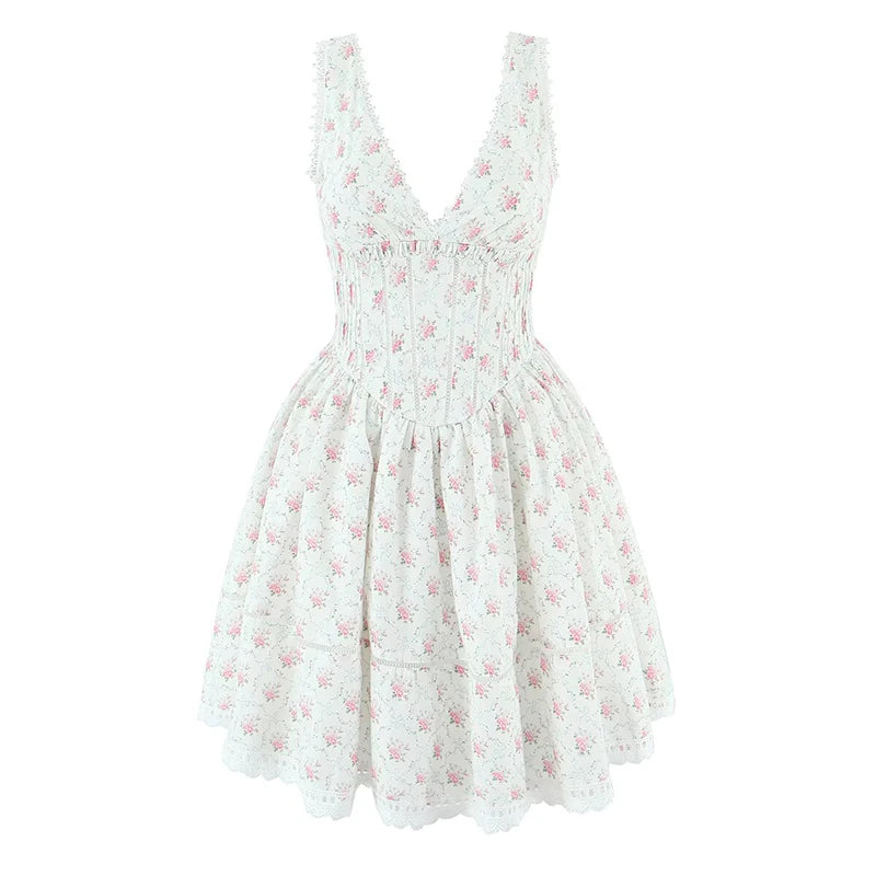 White dress with pink floral pattern on a white background